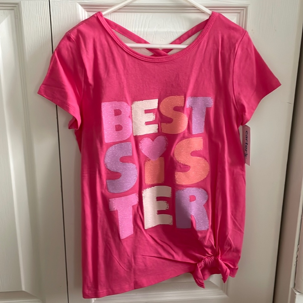 “Best sister” shirt with cutout in the back. Never worn. Tags attached. Size 10